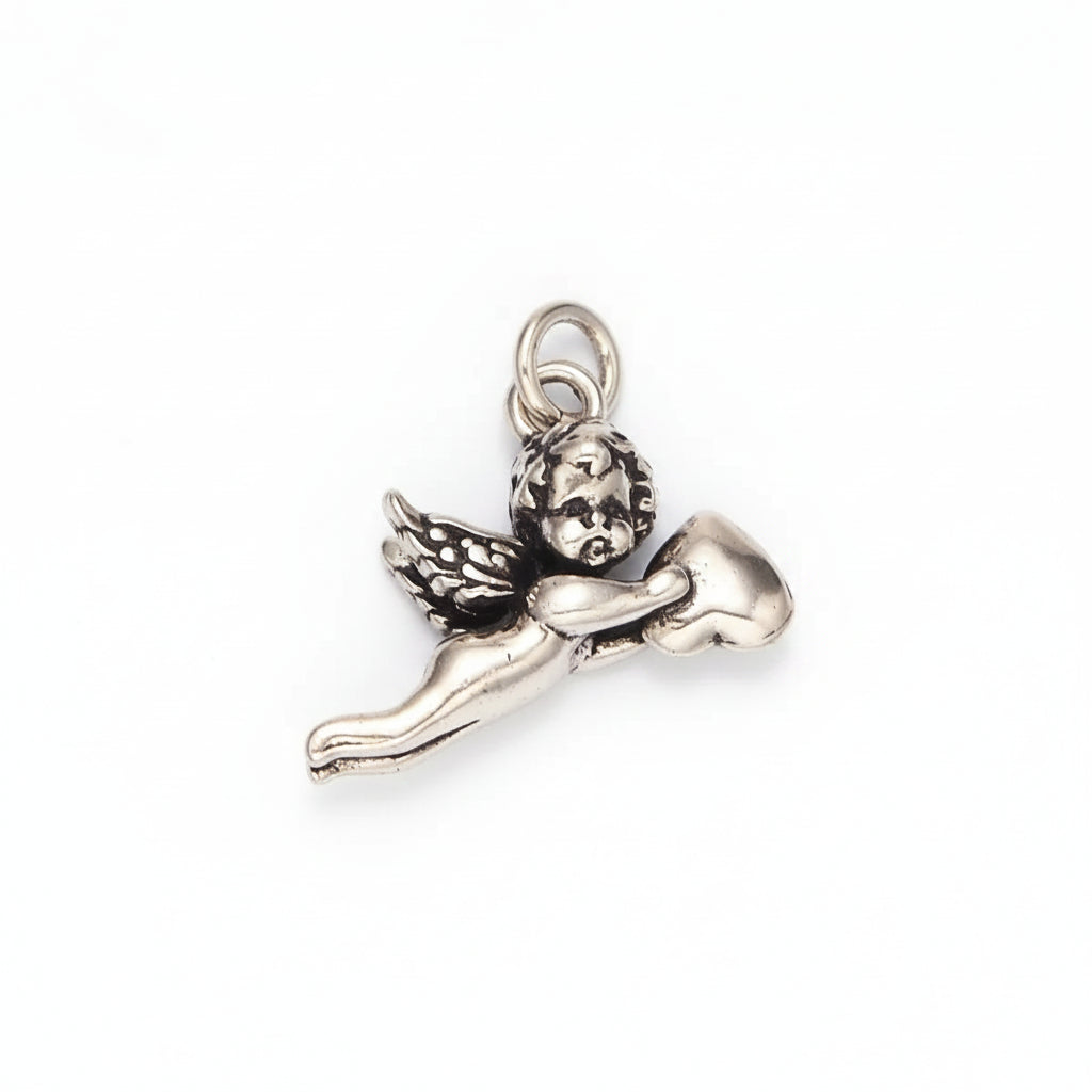 A silver-toned metal cherub pendant charm holding a heart, shown on a plain light background.