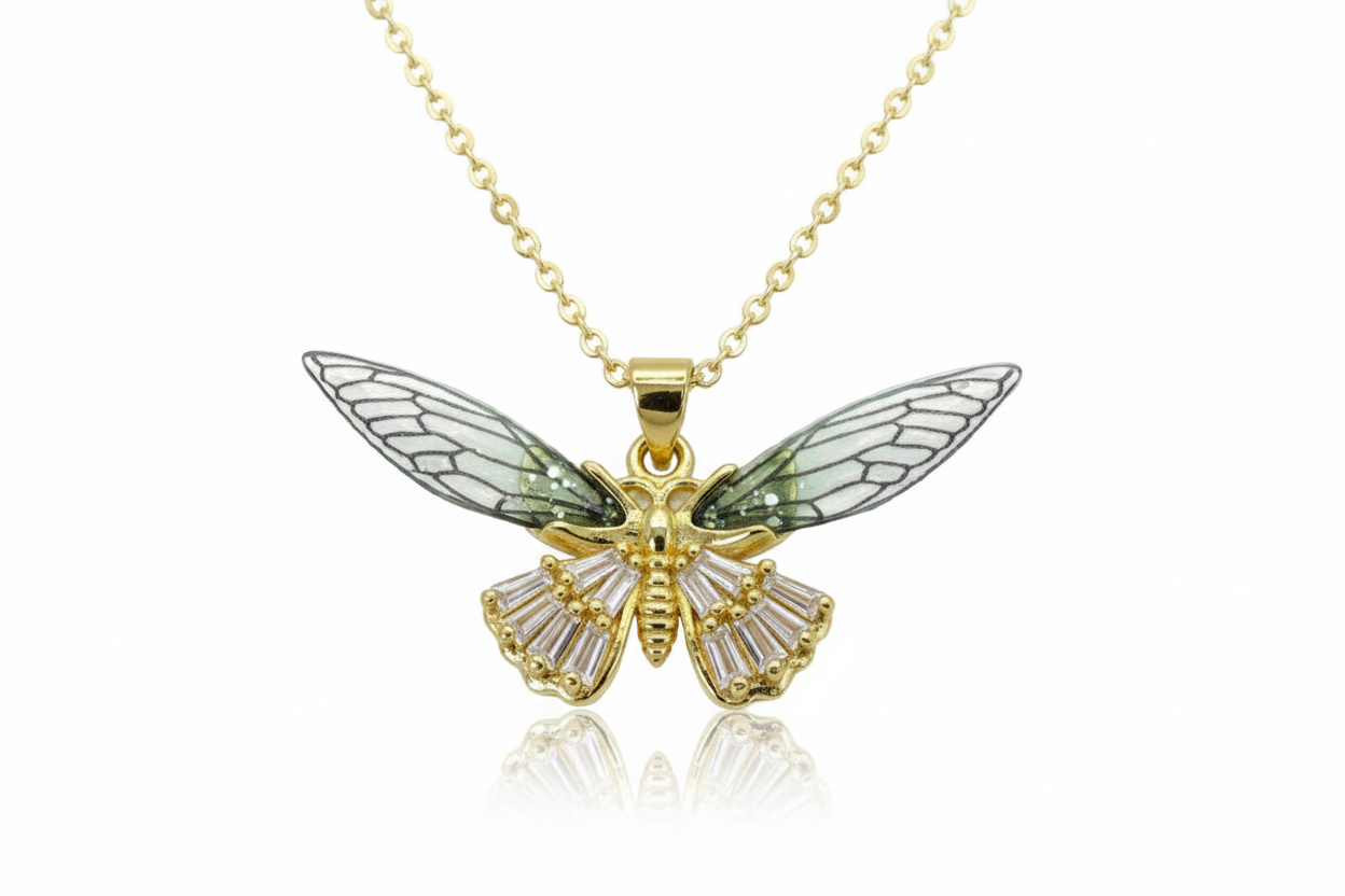 Gold butterfly pendant necklace on a white background