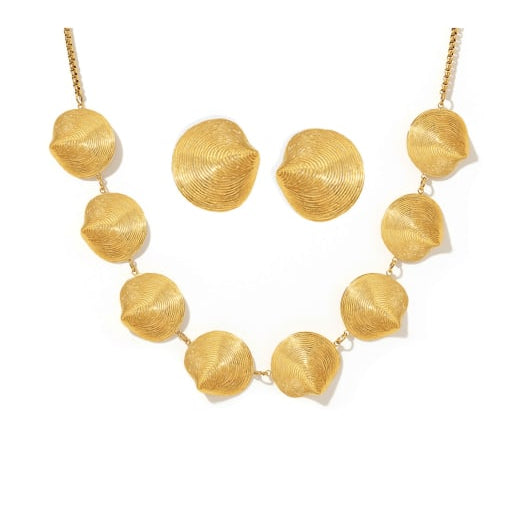 Gold necklace with leaf-like beads on a white background