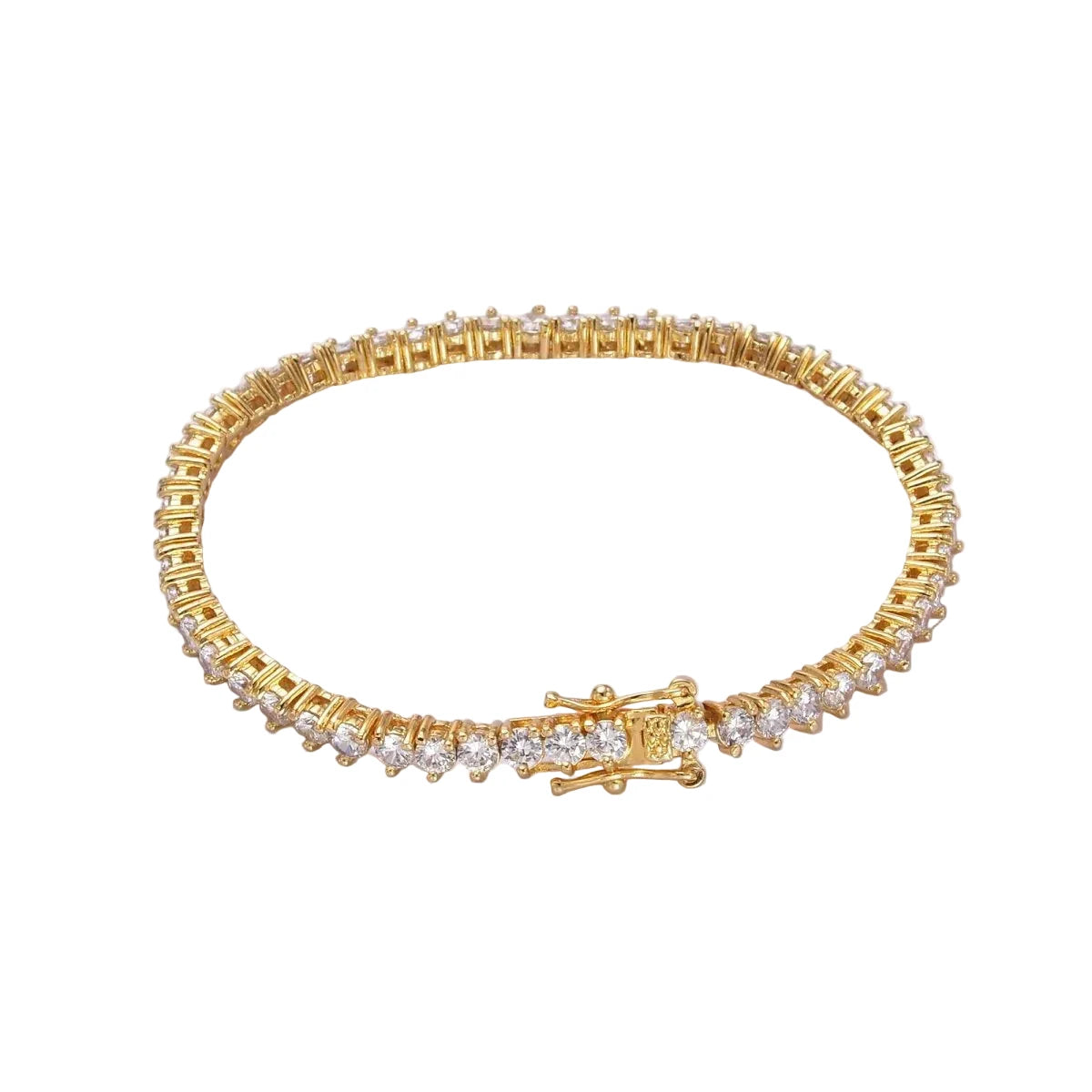 Gold bracelet with clear stones on a white background