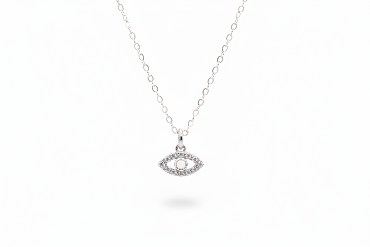 Silver necklace with an eye-shaped pendant on a white background