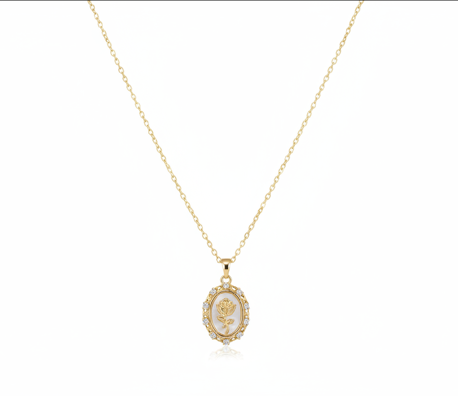 Gold necklace with a framed rose pendant on a white Background