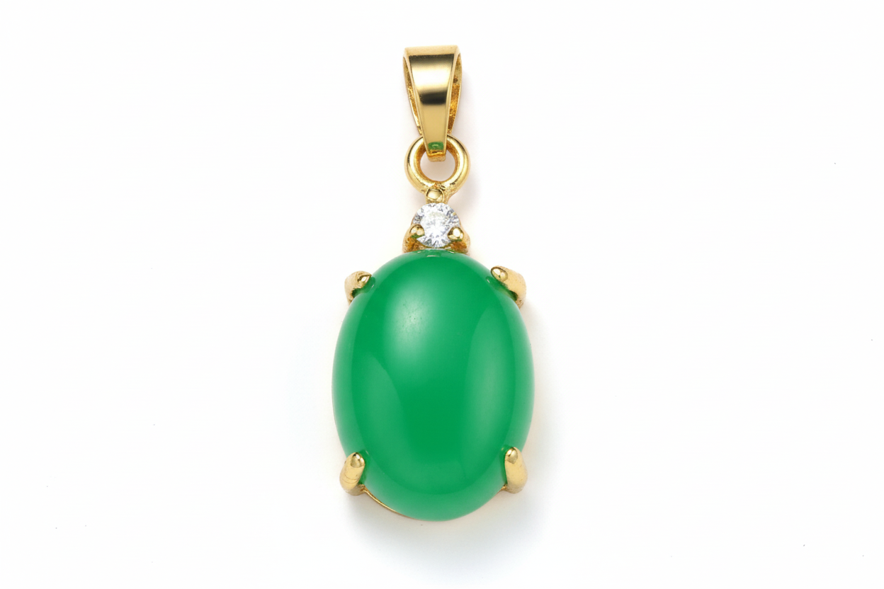 Green gemstone pendant with gold setting on a white background