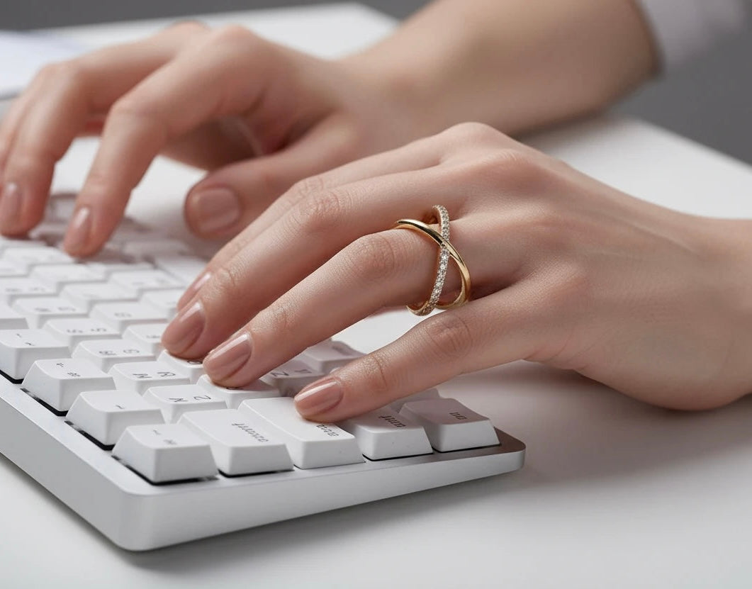 Woman typing on a keyboard wearing a Zizi Jewelry Ring