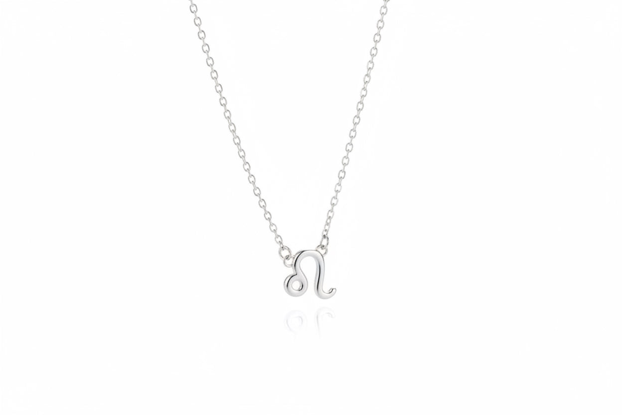 Silver necklace with a Leo zodiac symbol pendant on a white surface