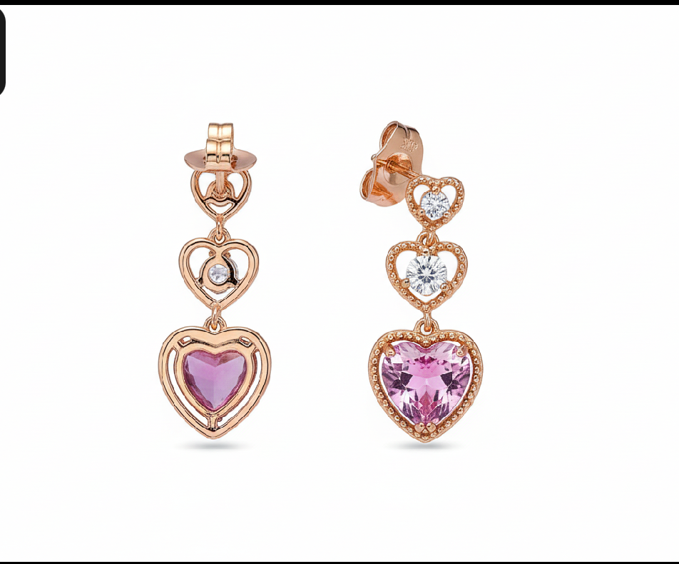 Rose gold heart-shaped earrings with pink gemstones on a smartphone screen with editing interface.