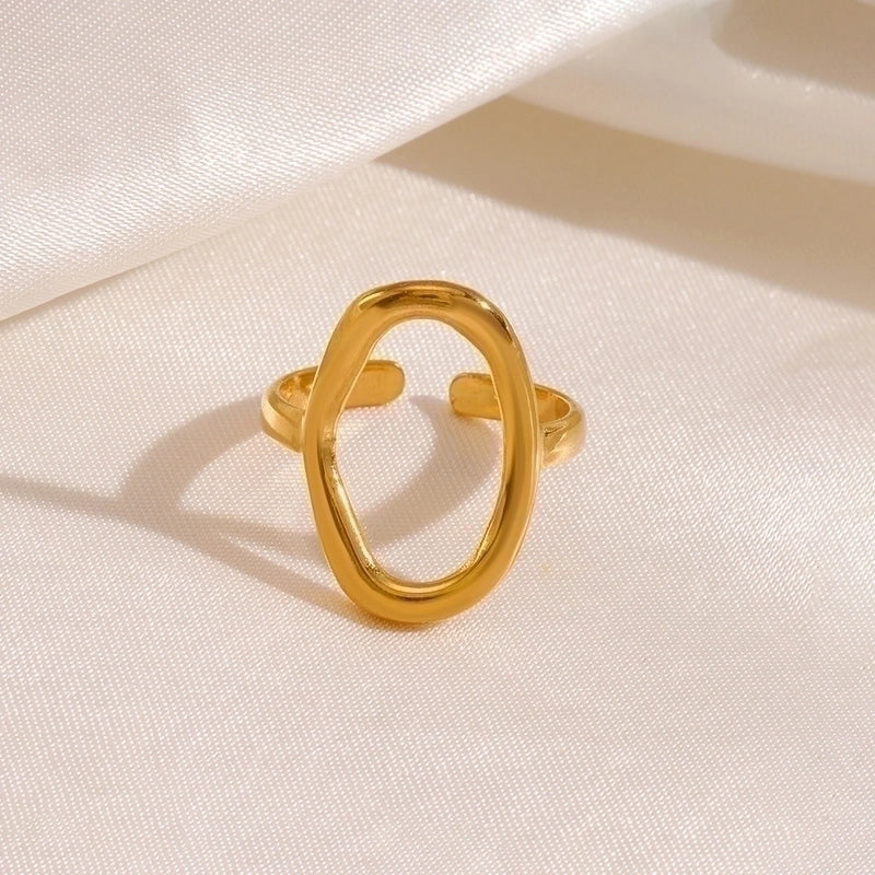 Gold ring on a light beige fabric background