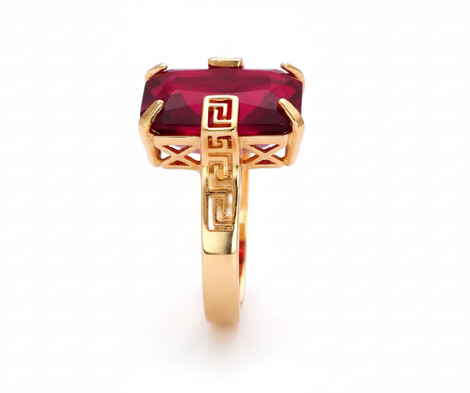 Gold ring with a red gemstone on a smartphone screen with editing interface.
