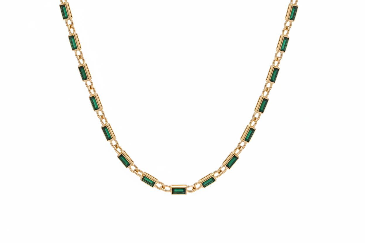 Necklace with green gemstones on a white background