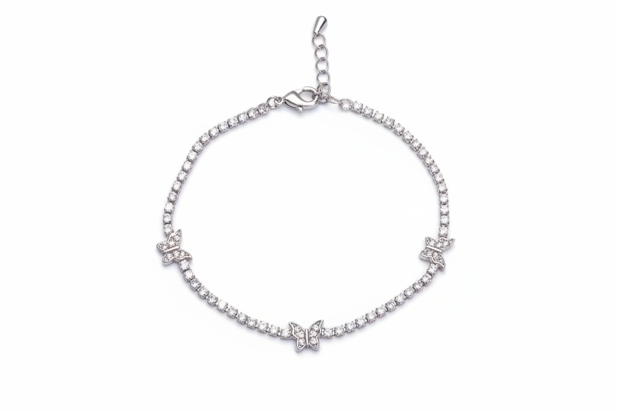 Silver bracelet with butterfly charms on a white background