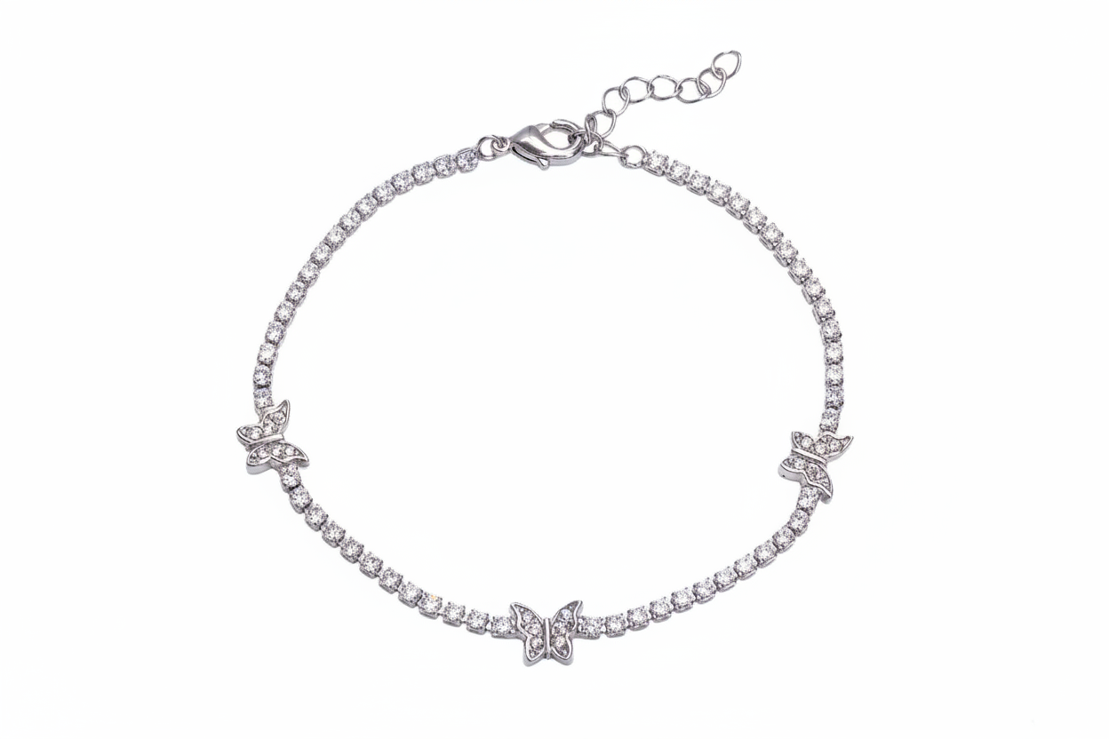 Silver bracelet with butterfly charms on a white background