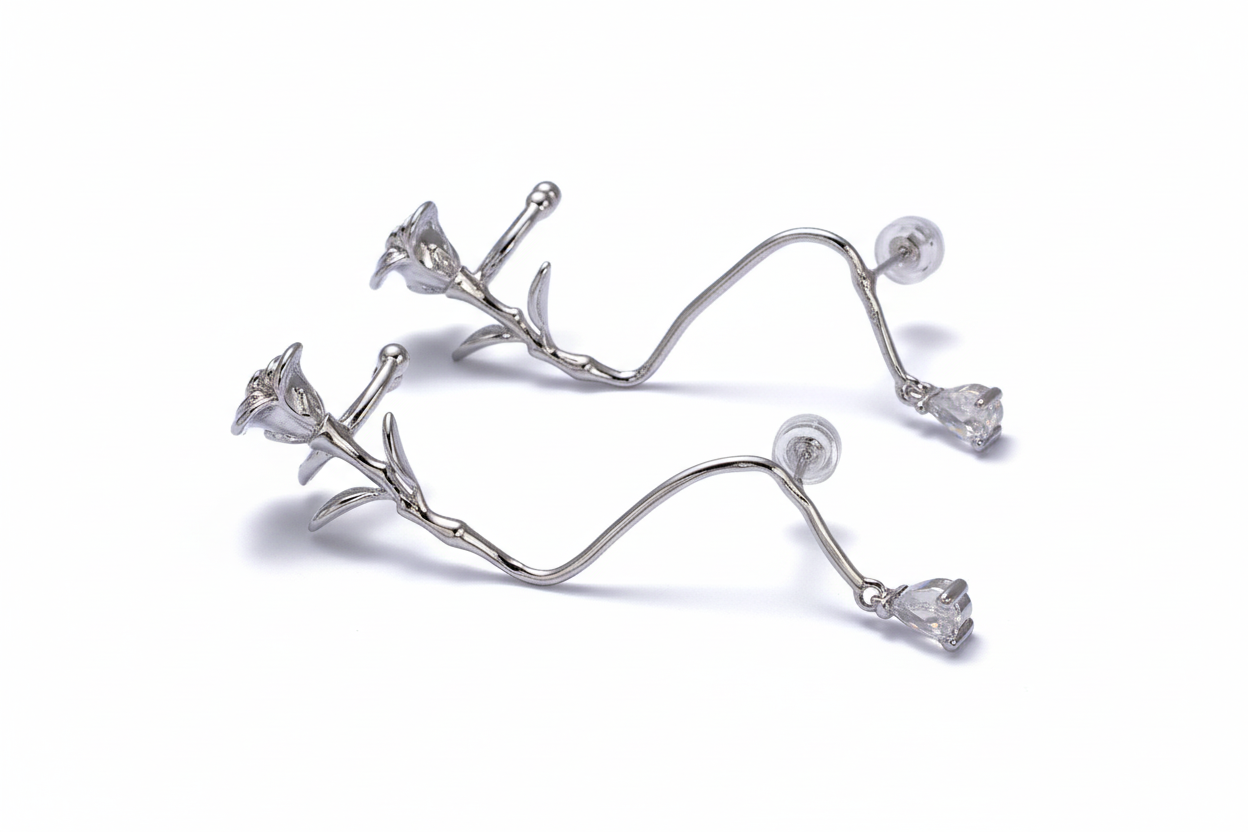 Silver floral earrings on a white background