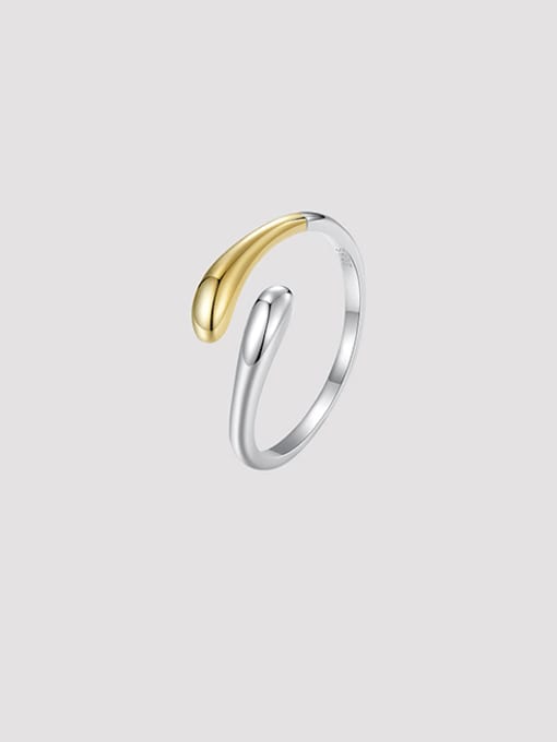 gold and silver ring on a light gray background