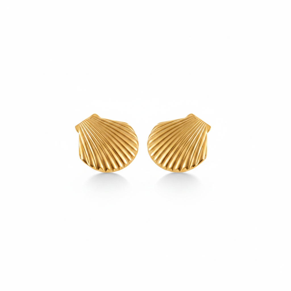 Gold shell-shaped earrings on a white background