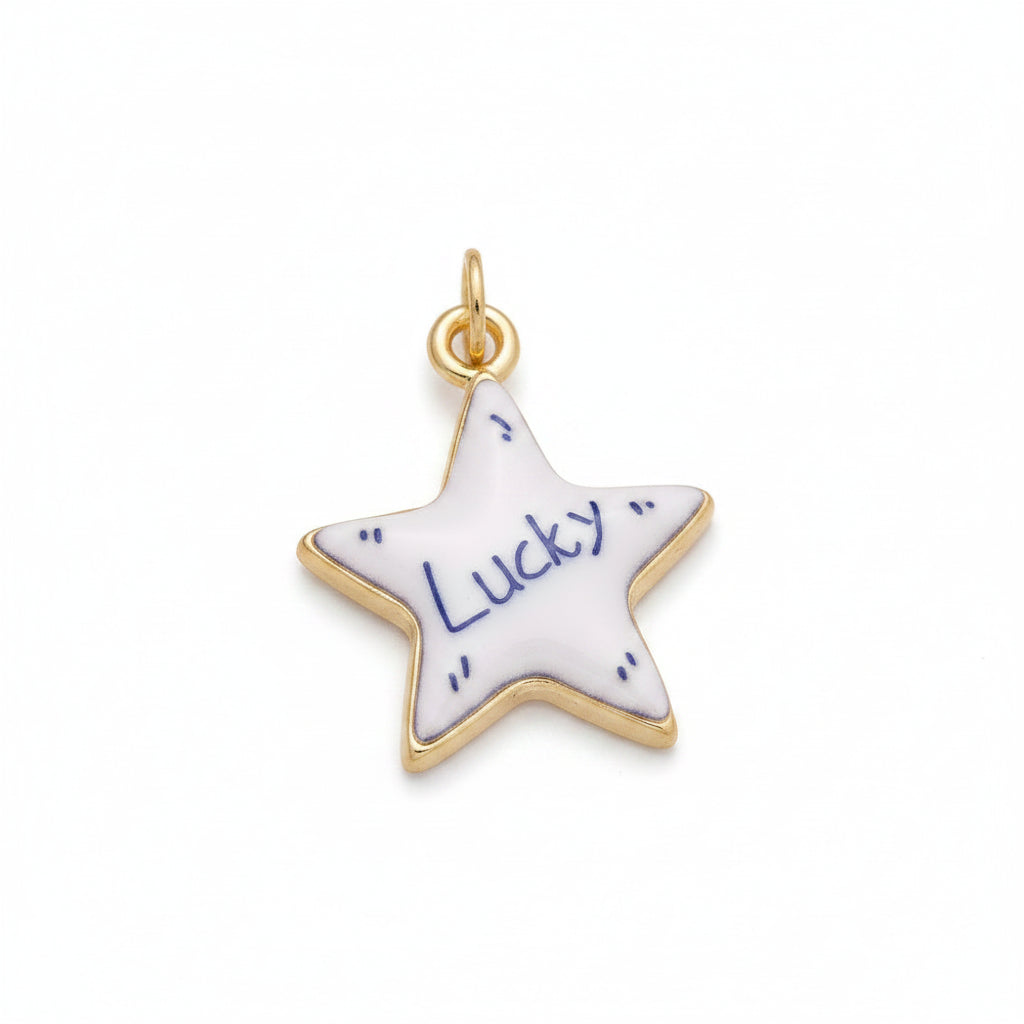 A five-pointed star-shaped charm with a white enamel face, blue border lines, the word 'Lucky' in script, and a gold-tone metal outline and top loop, shown on a plain white background.