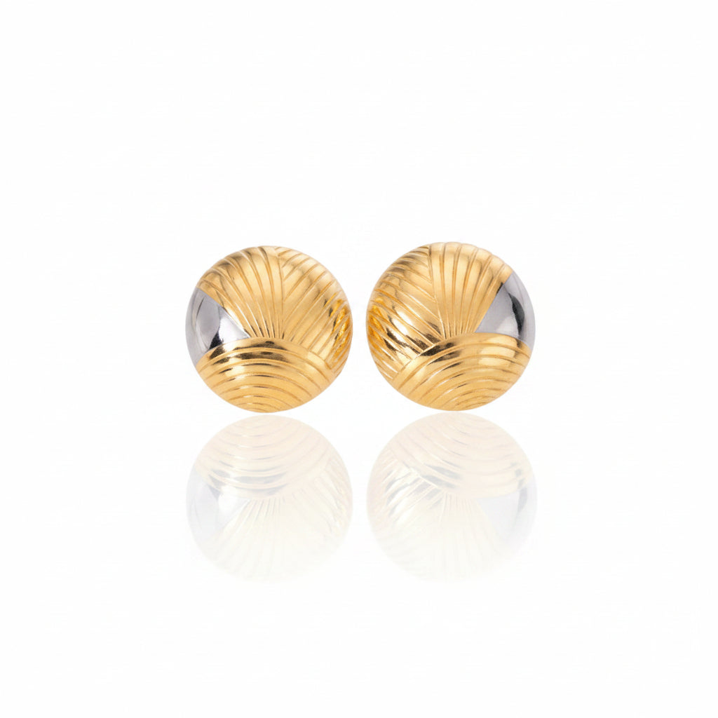 Pair of gold earrings on a white background