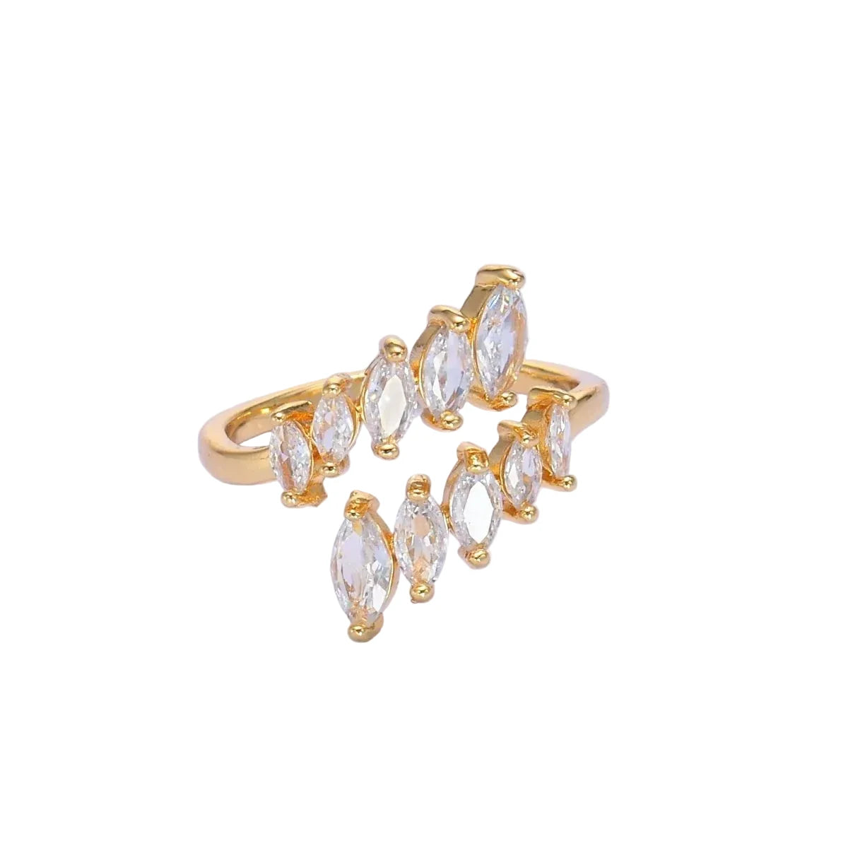 Gold ring with clear gemstones on a light purple background