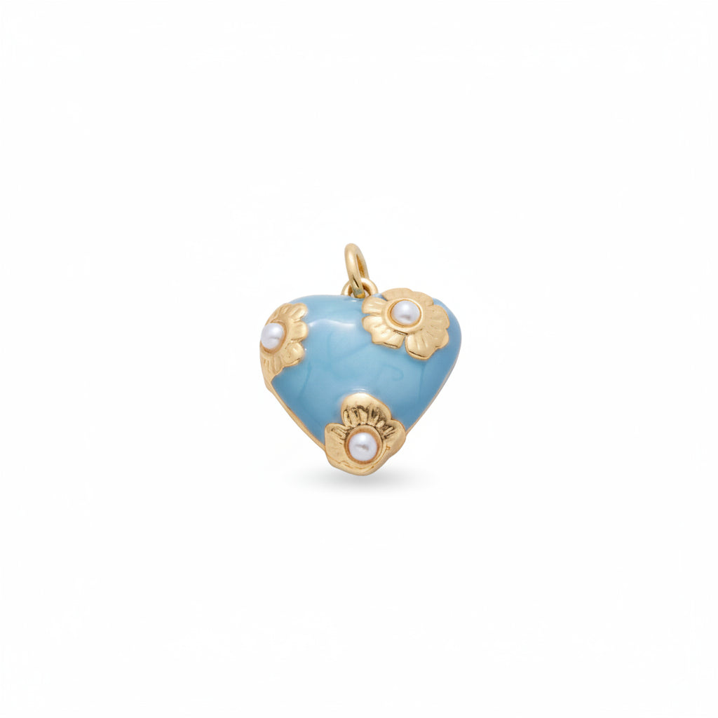 A pair of heart-shaped gold and light blue enamel earrings with pearl-like floral accents, displayed on a clean white background.