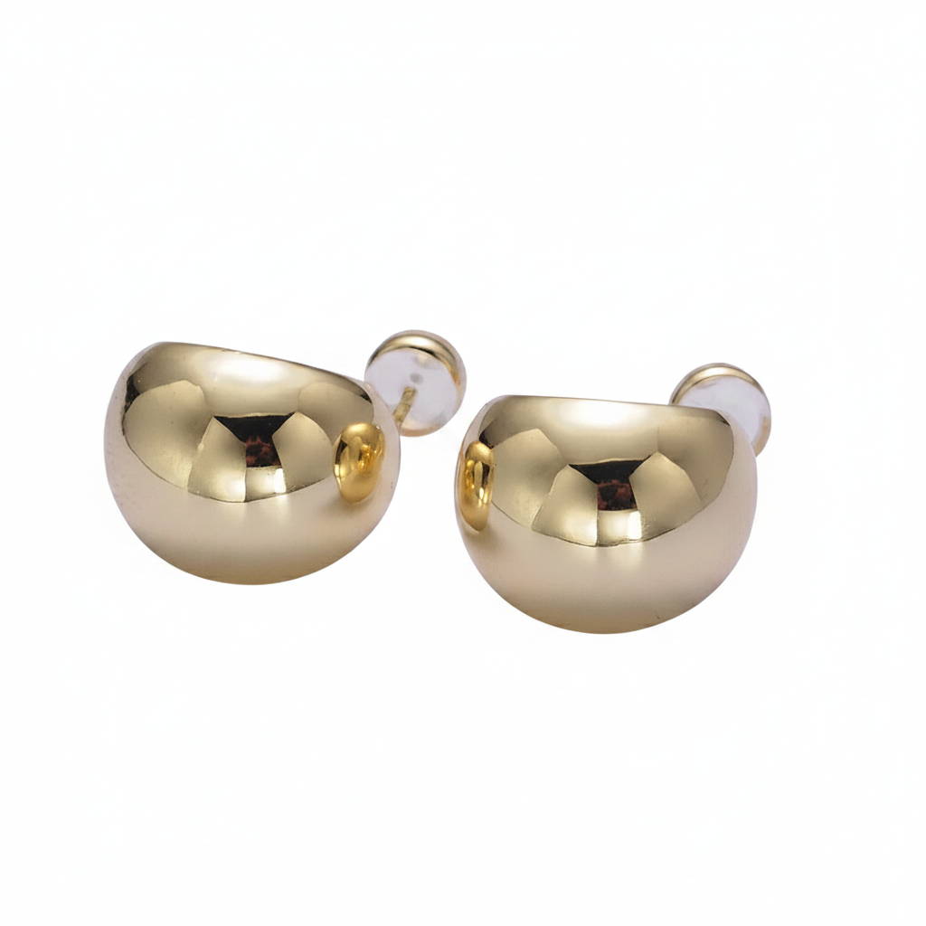 Pair of gold earrings on a white background