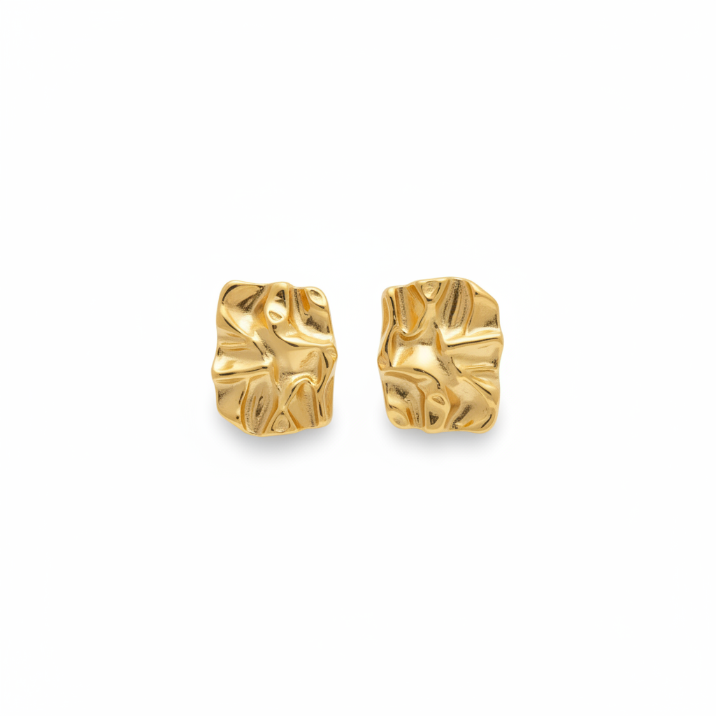 Pair of gold earrings on a white background