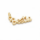 A gold-plated script charm spelling 'Bestie' with a small top loop, shown on a clean white background.