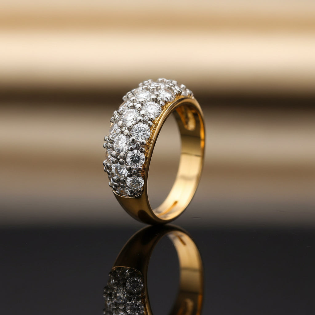 Gold ring with diamond stones on a blurry background