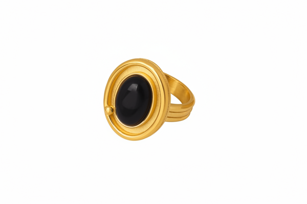 Gold ring with a large oval black agate stone, shown with dimension lines and text indicating size, weight, and material on a white background.