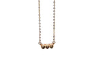 Gold necklace with heart-shaped charms on a white background