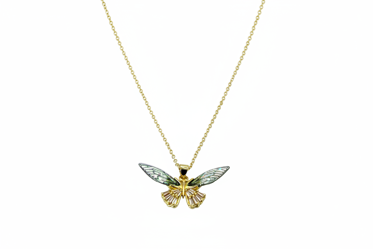 Gold butterfly pendant necklace on a white background