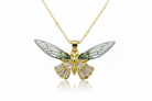Gold butterfly pendant necklace on a white background