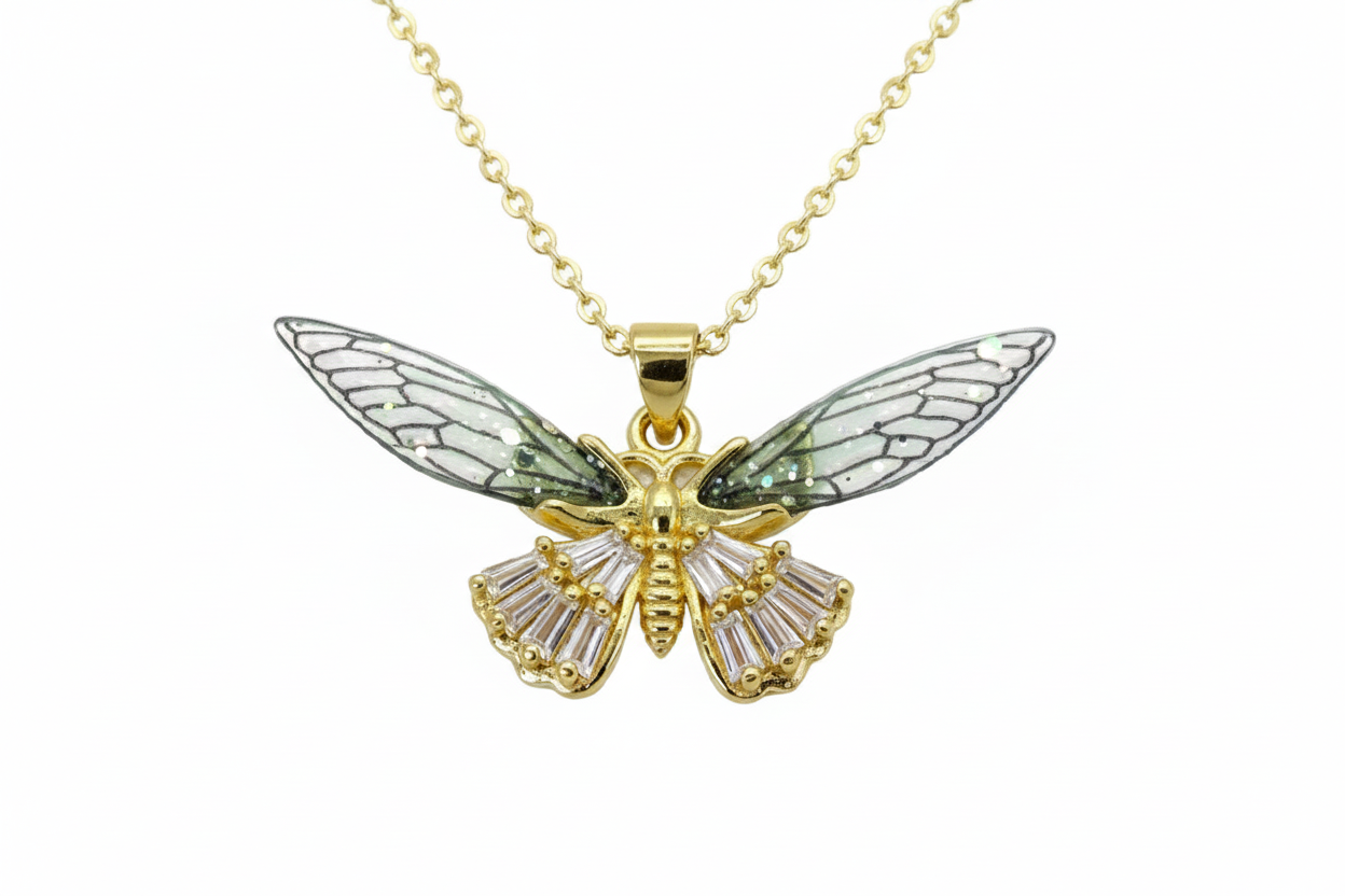 Gold butterfly pendant necklace on a white background