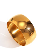 Gold bangle on a white background