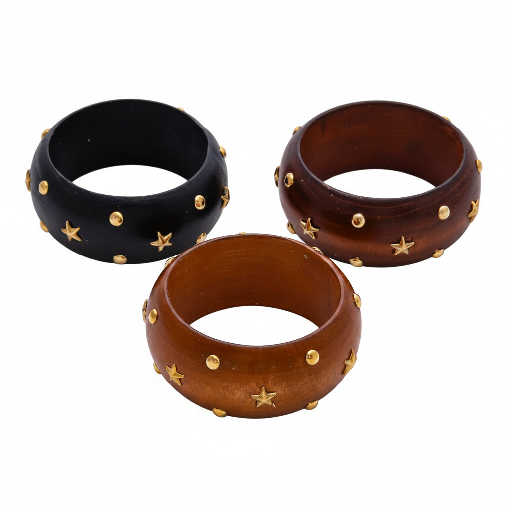 Three wooden bangles with star-shaped embellishments on a white background