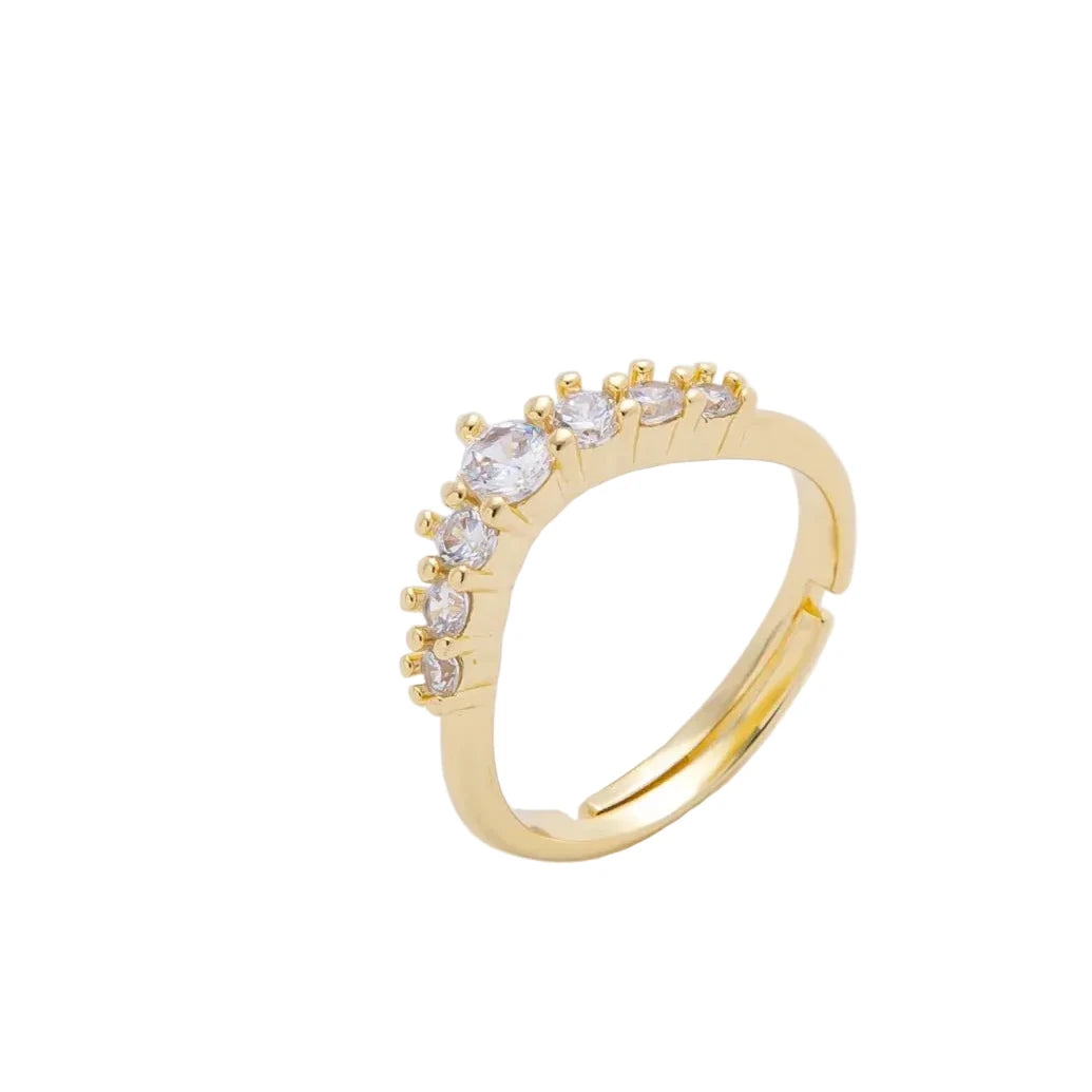 Gold ring with embedded diamonds on a white background
