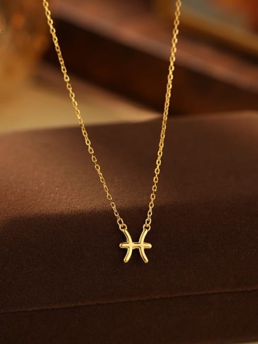 Gold necklace with a starfish pendant on a brown surface