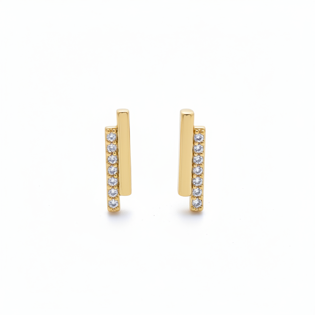 Gold earrings with small diamonds on a white background