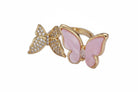 Gold ring with pink butterfly design on a white background