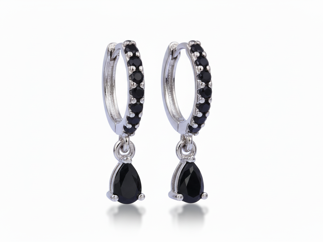 Pair of black teardrop earrings with silver hoop designs on a white background