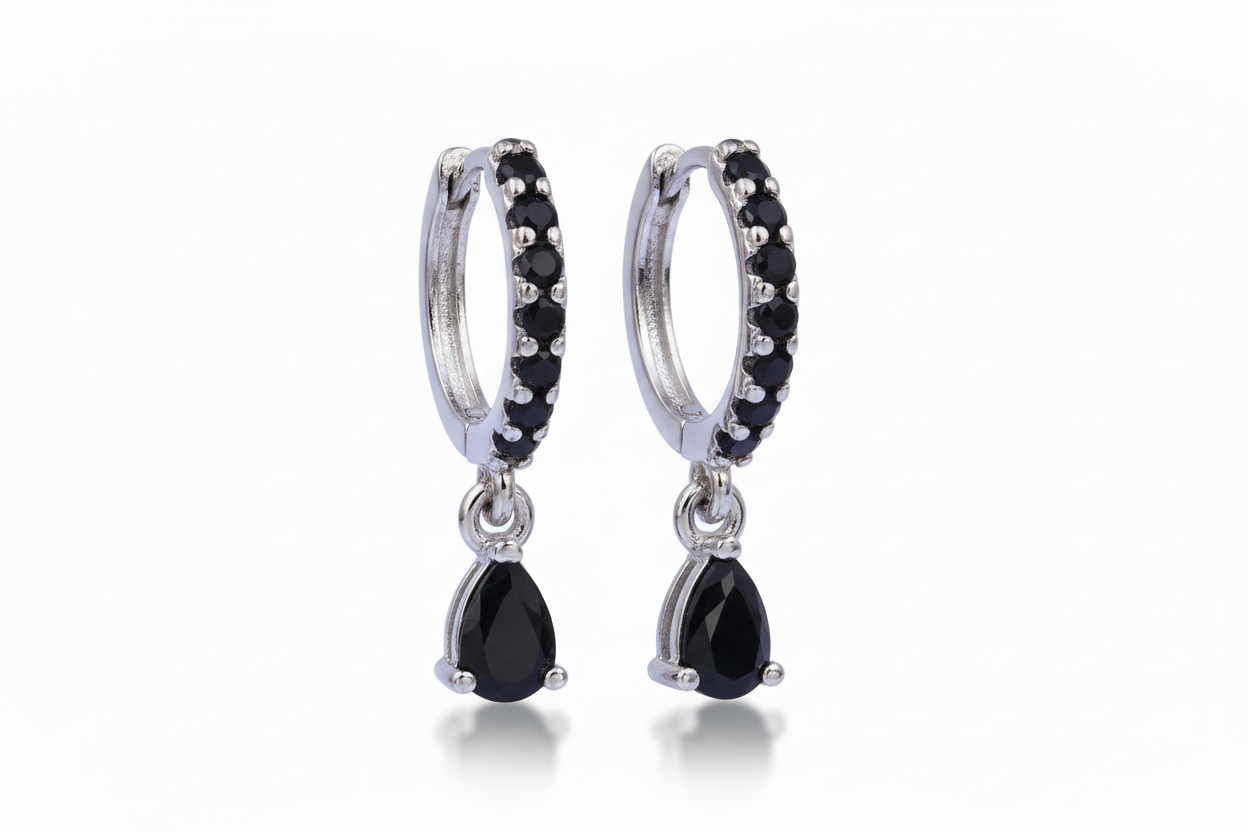 Pair of black teardrop earrings with silver hoop designs on a white background