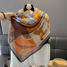 Colorful scarf with fox design on a hanger against a neutral background