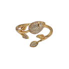 Gold ring with leaf designs on a white background 