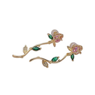 Gold rose earrings with floral and leaf designs 