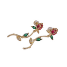 Gold earrings with red and green gemstones