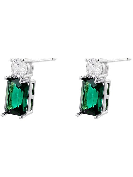 Pair of earrings with green gemstones and silver settings on a white background