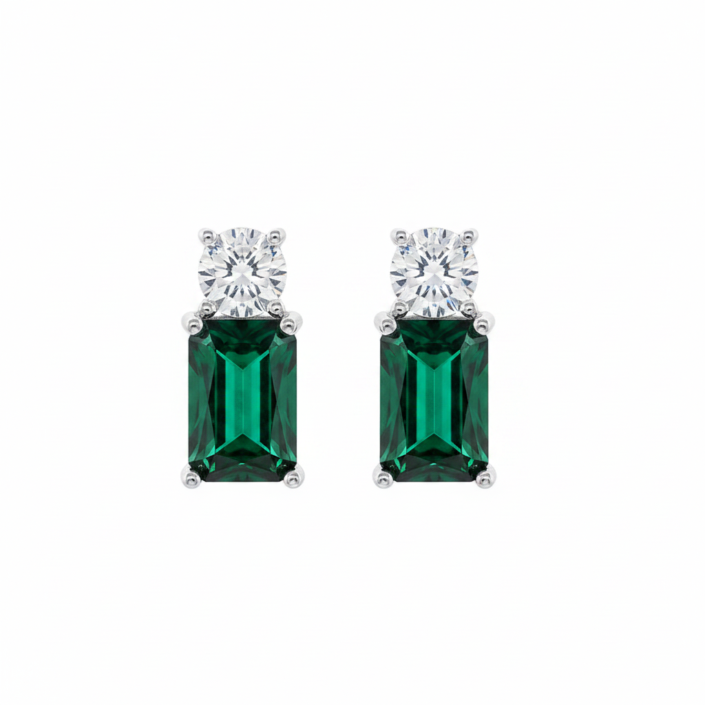Pair of emerald-cut gemstone earrings with clear stones on a white background