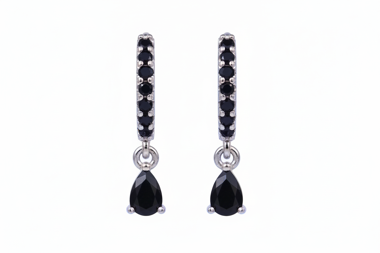 Pair of black teardrop earrings with silver accents on a white background
