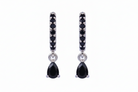 Pair of black teardrop earrings with silver accents on a white background