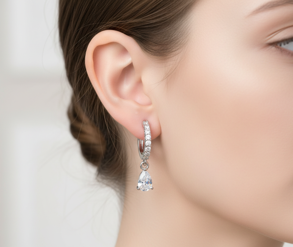 Close-up of a woman wearing a diamond earring with a blurred background