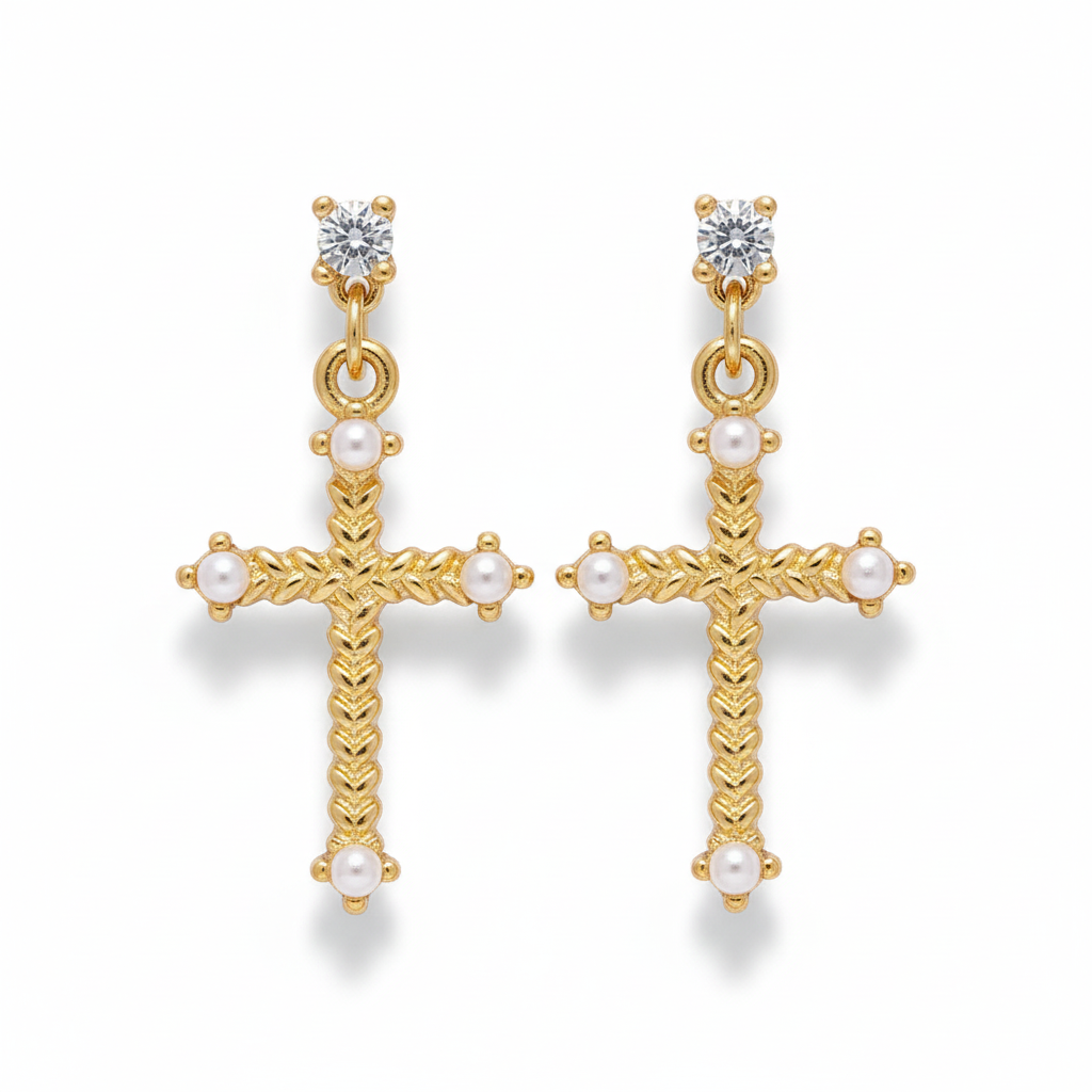 Gold cross earrings with pearls on a white background