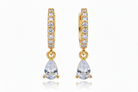 A pair of gold huggie hoop earrings adorned with small clear round-cut stones and featuring a teardrop-shaped clear gemstone dangle, shown against a plain white background.